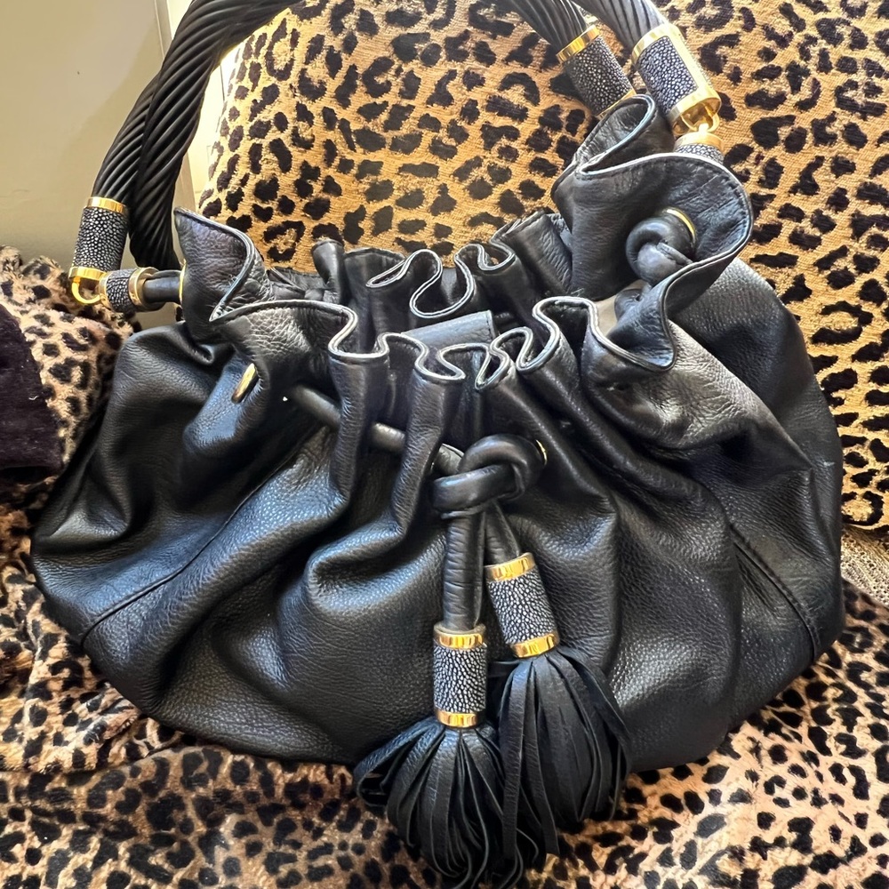 Black and Gold Pebbled Leather Bag by Michael Kors.